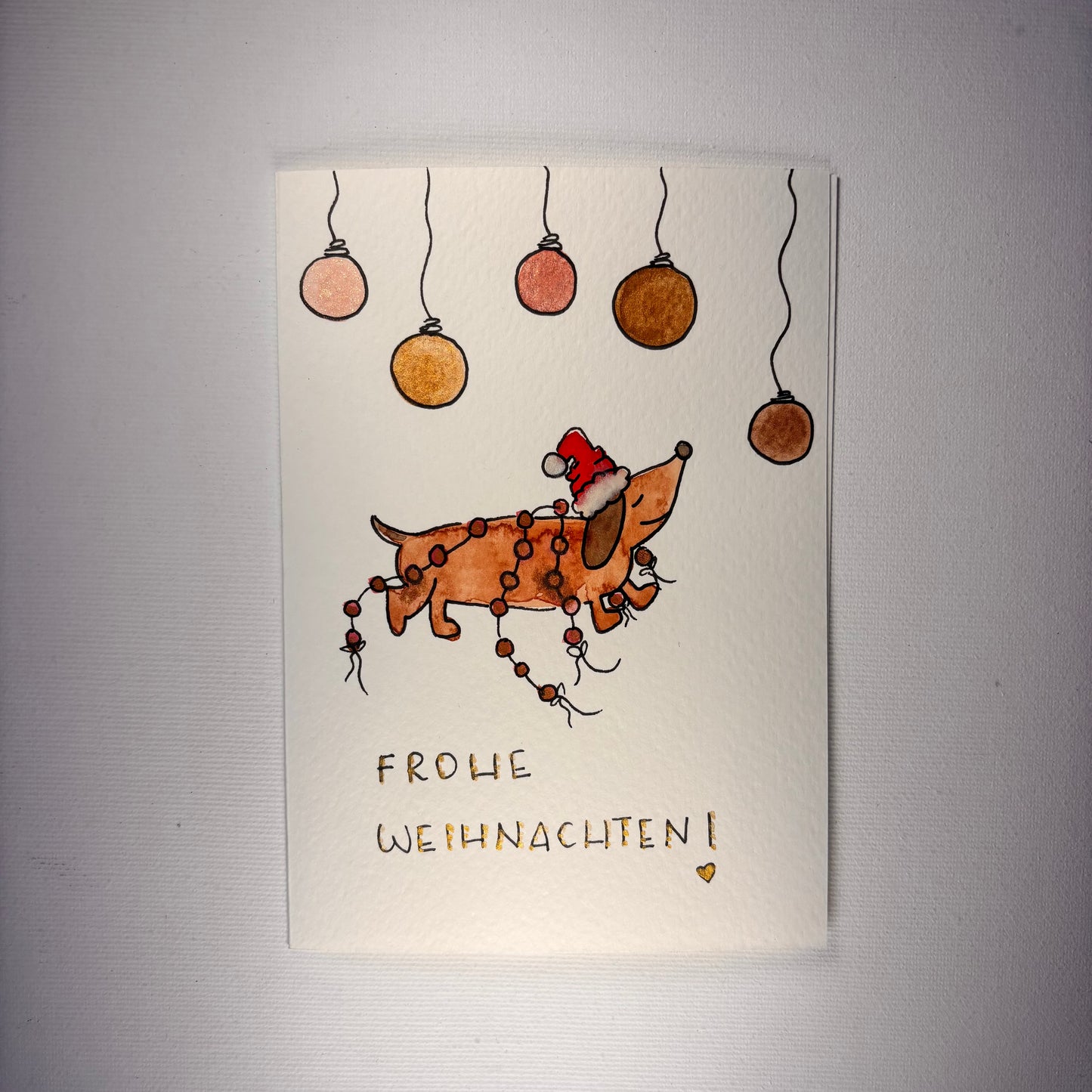 Weihnachten - Dackel mit Weihnachtskugeln