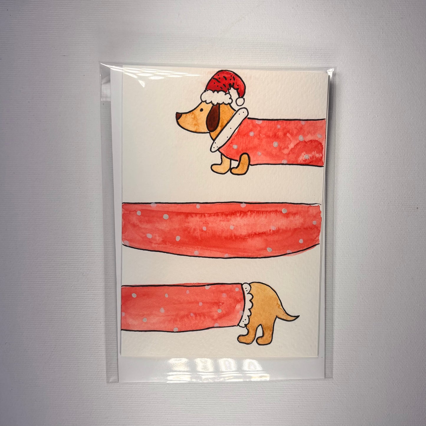 Weihnachten - Dackel mit Weihnachtsmannanzug