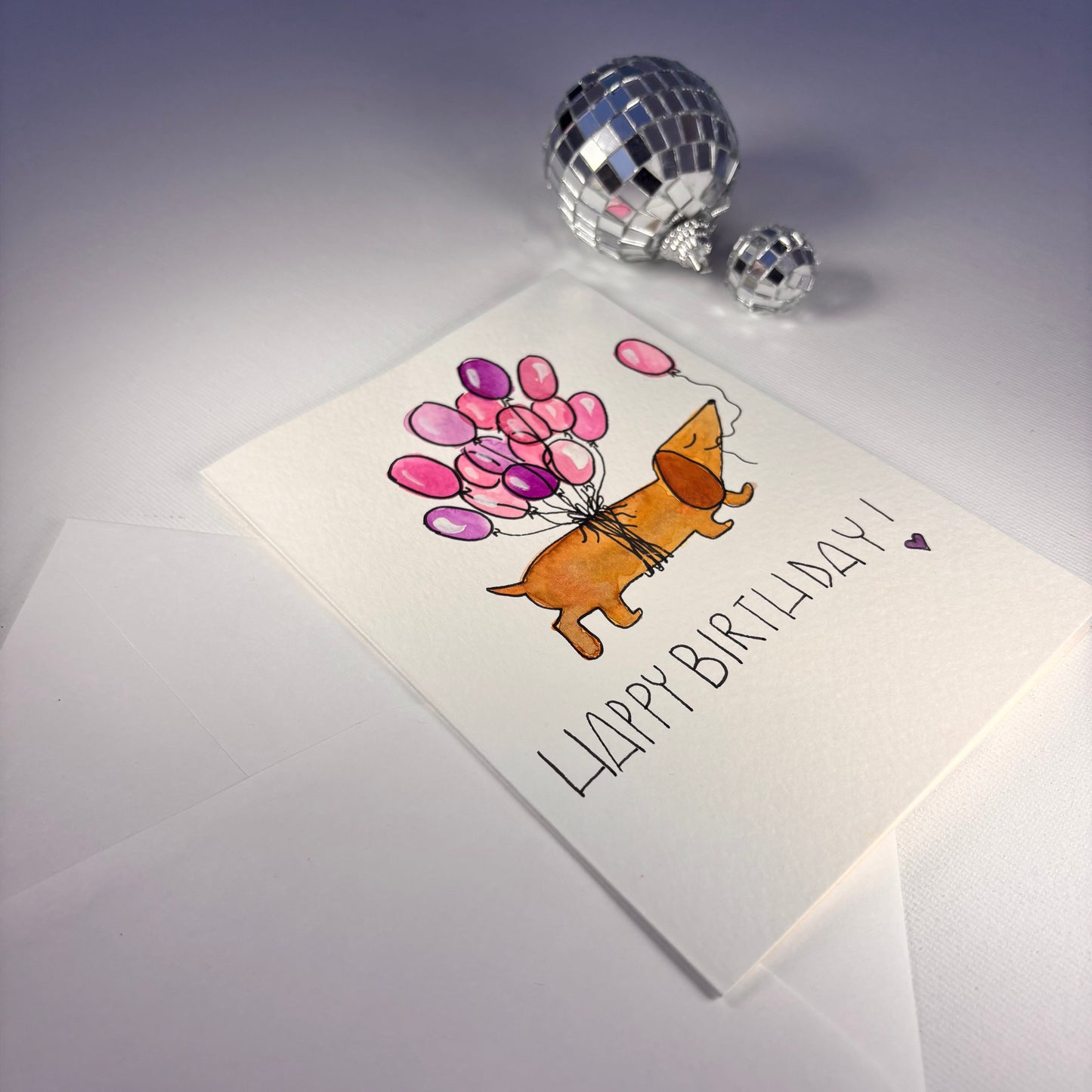 Compleanno - bassotto venditore di palloncini