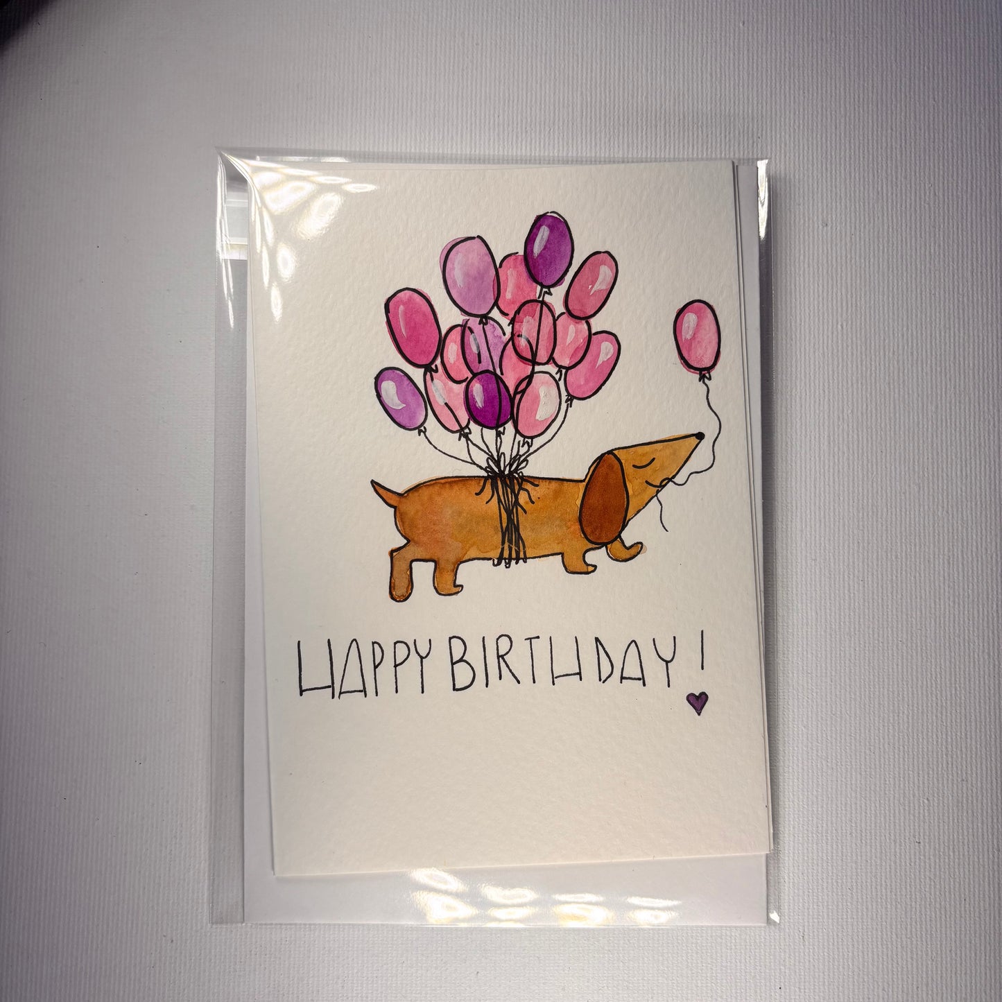 Compleanno - bassotto venditore di palloncini