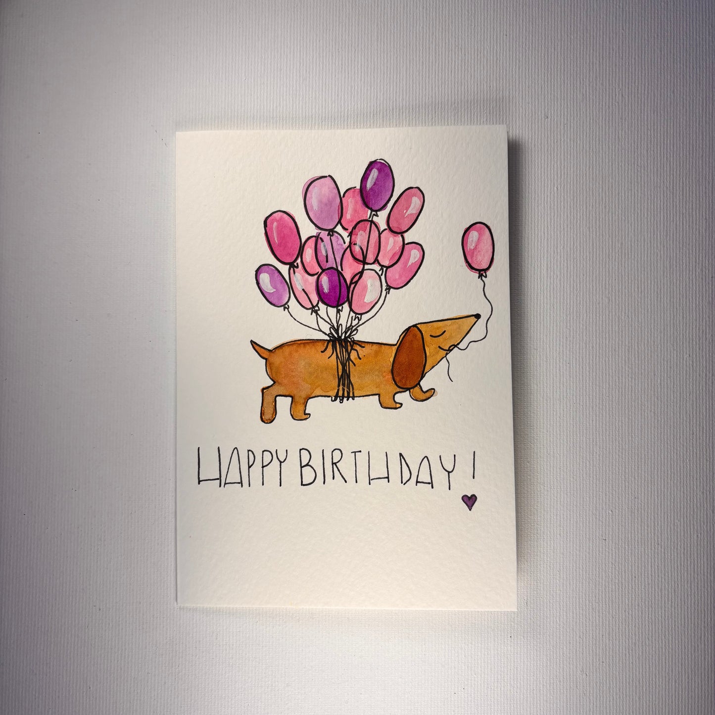 Compleanno - bassotto venditore di palloncini